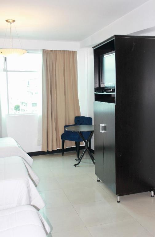 Postel nebo postele na pokoji v ubytování Hotel Presidente Internacional