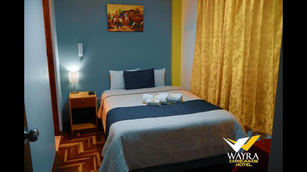 Postel nebo postele na pokoji v ubytování Hotel Wayra Dreams