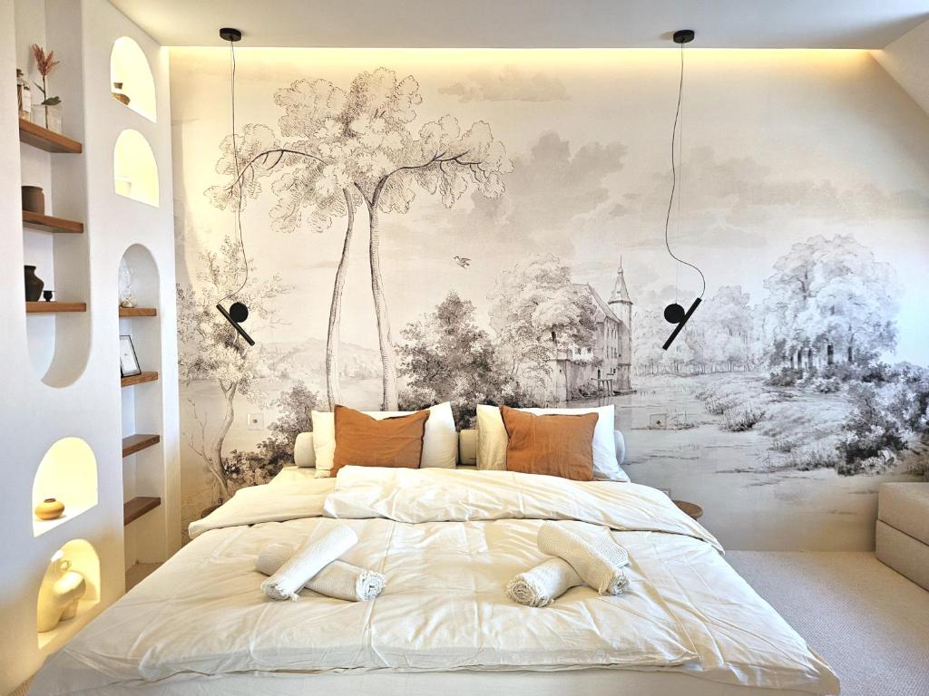 a bedroom with a tree mural on the wall at NEW Design Top-Class Suite next to the Castle-Free Parking-Terrace in Bratislava