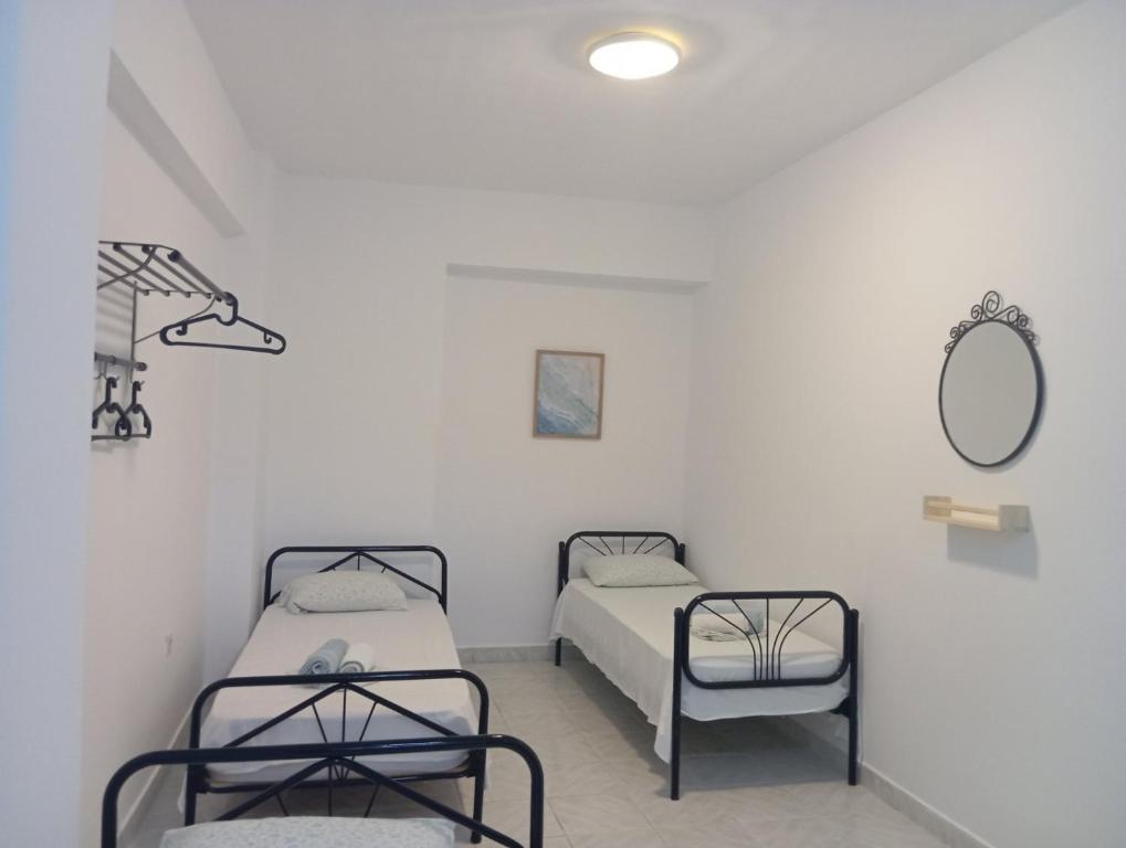 Postel nebo postele na pokoji v ubytování Sirocco Seaside