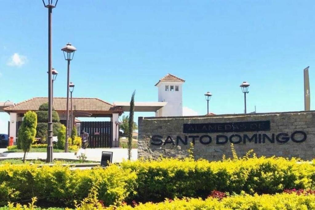 a sign for santa domingo in front of a building at Casa Alamedas Carretera a El Salvador in Pampumay