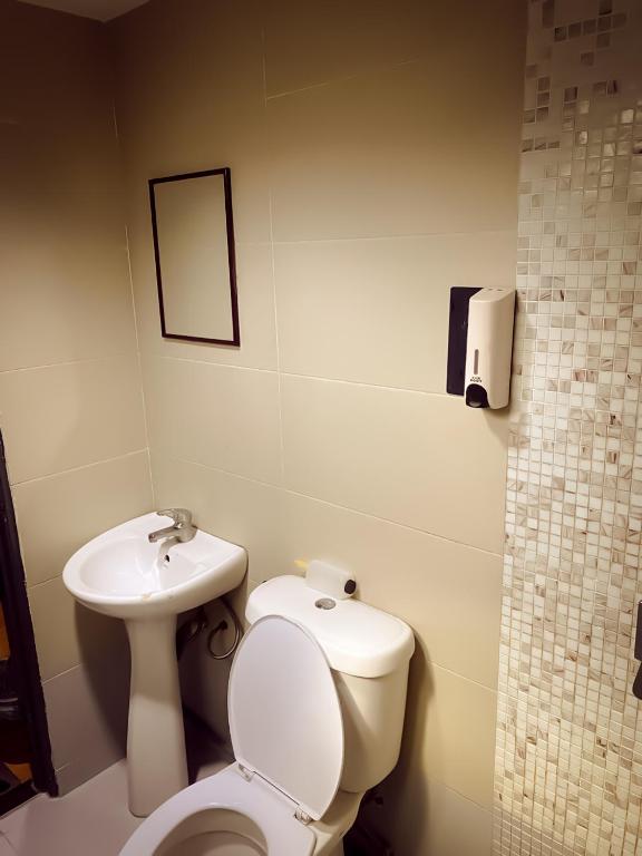 Koupelna v ubytování TM Hotel