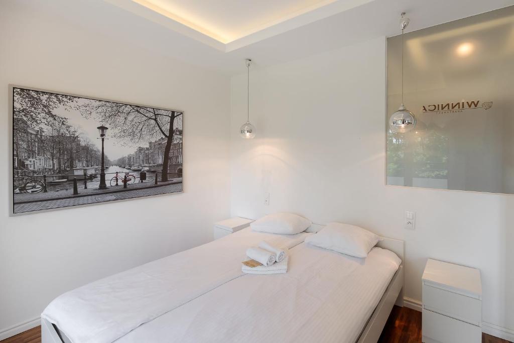 Posteľ alebo postele v izbe v ubytovaní Apartament Winnica Widok na Wisłę