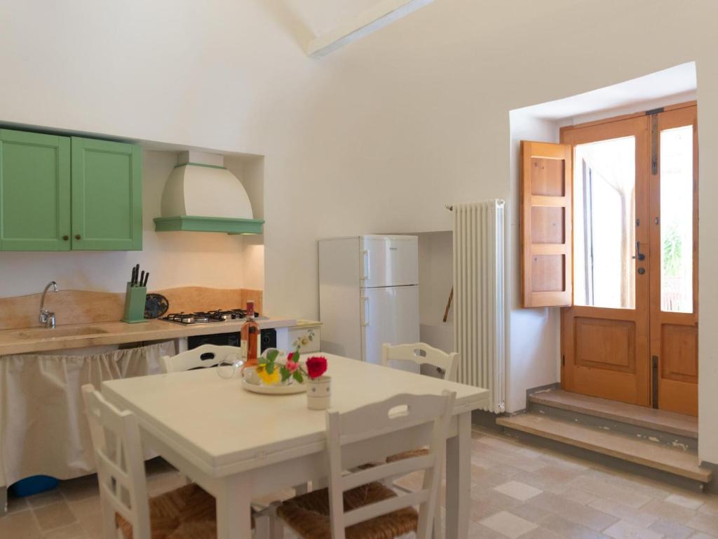 A kitchen or kitchenette at Historic Trulli Azzalema in Cisternino