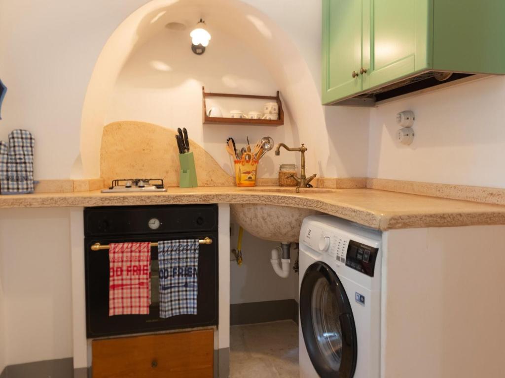 A kitchen or kitchenette at Historic Trulli Azzalema in Cisternino