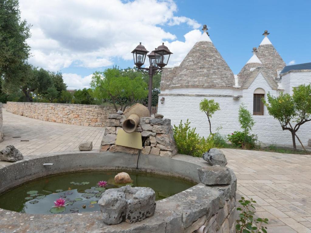 A garden outside Historic Trulli Azzalema in Cisternino