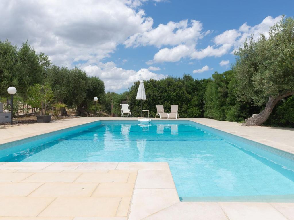 The swimming pool at or close to Historic Trulli Azzalema in Cisternino