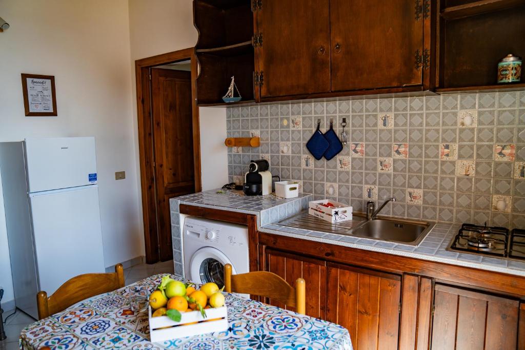 Kuchyň nebo kuchyňský kout v ubytování NIMA Holidays Home