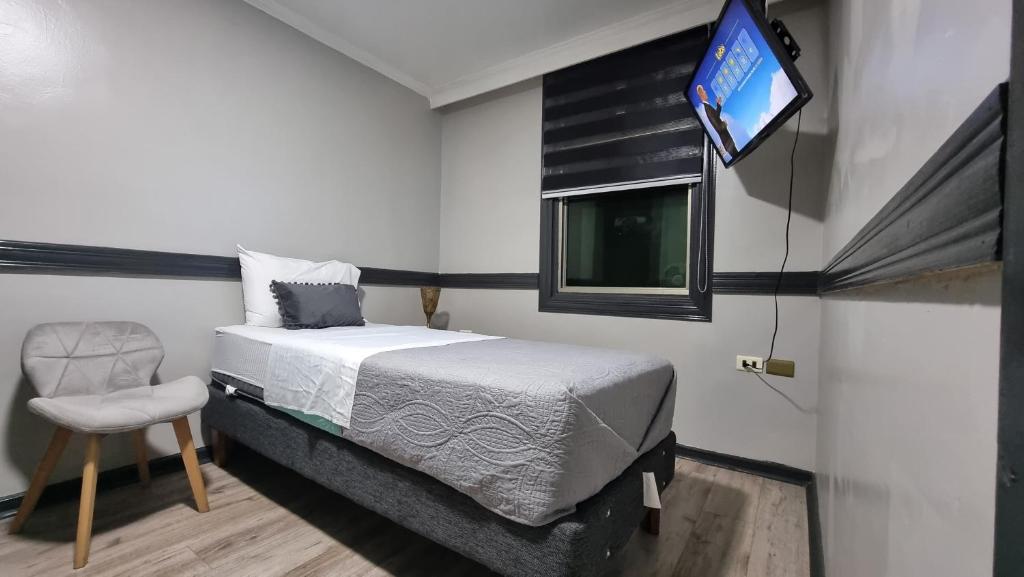 Postel nebo postele na pokoji v ubytování Hotel Asturias