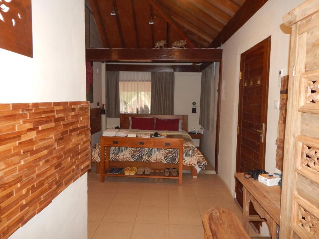 Postel nebo postele na pokoji v ubytování Alamanda Family Villas, Pool & Local Tours