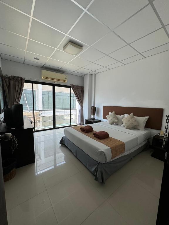 Postel nebo postele na pokoji v ubytování Orchid Residence Samui