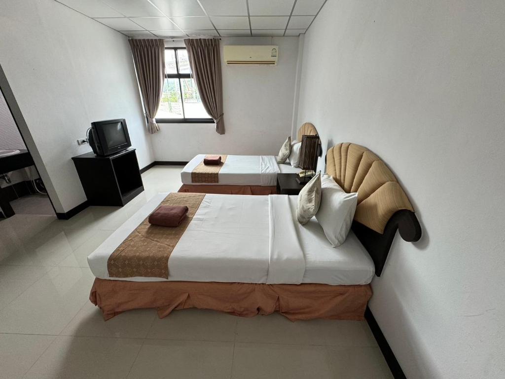 Postel nebo postele na pokoji v ubytování Orchid Residence Samui