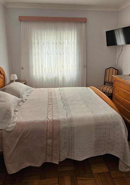 Postel nebo postele na pokoji v ubytování Casa da Praia