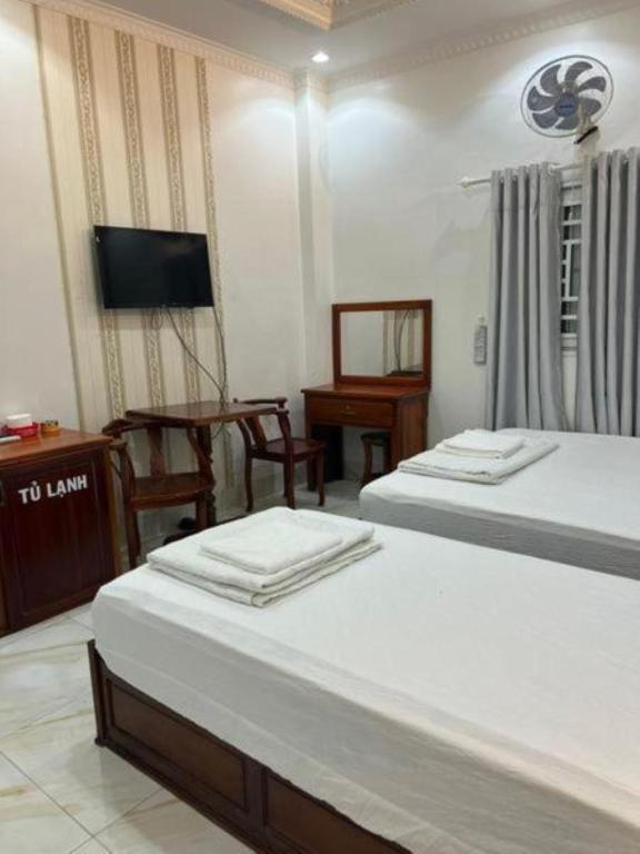 Postel nebo postele na pokoji v ubytování Sao Mai Hotel Can Tho