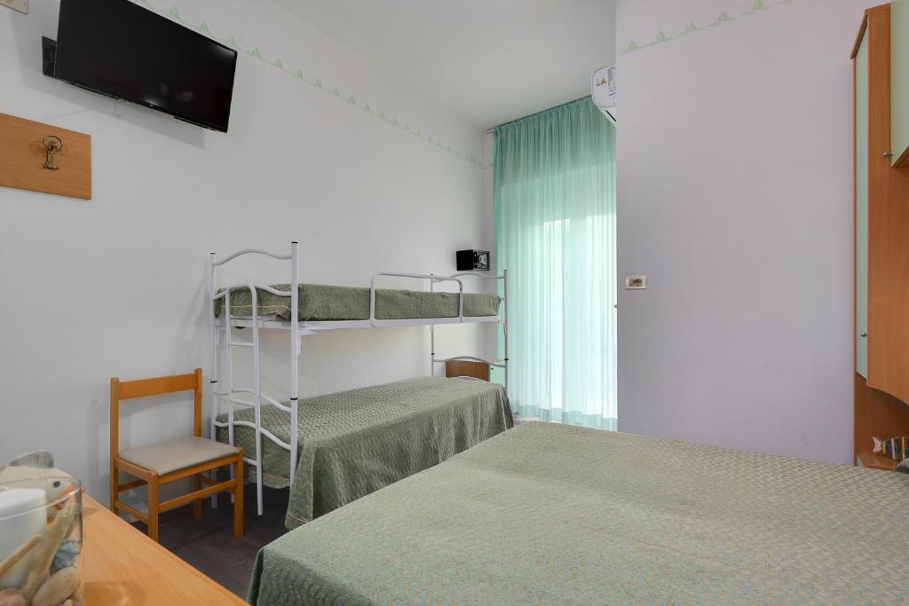 Postel nebo postele na pokoji v ubytování Hotel Gaia