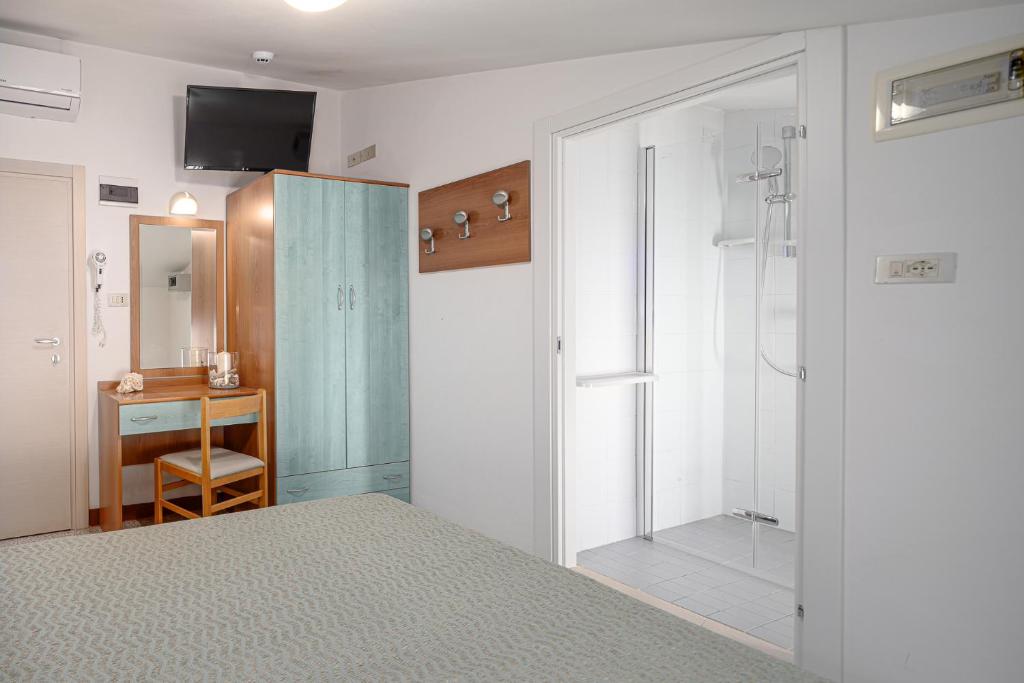 TV a/nebo společenská místnost v ubytování Hotel Gaia