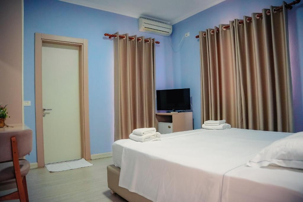 Postel nebo postele na pokoji v ubytování Hotel Andi