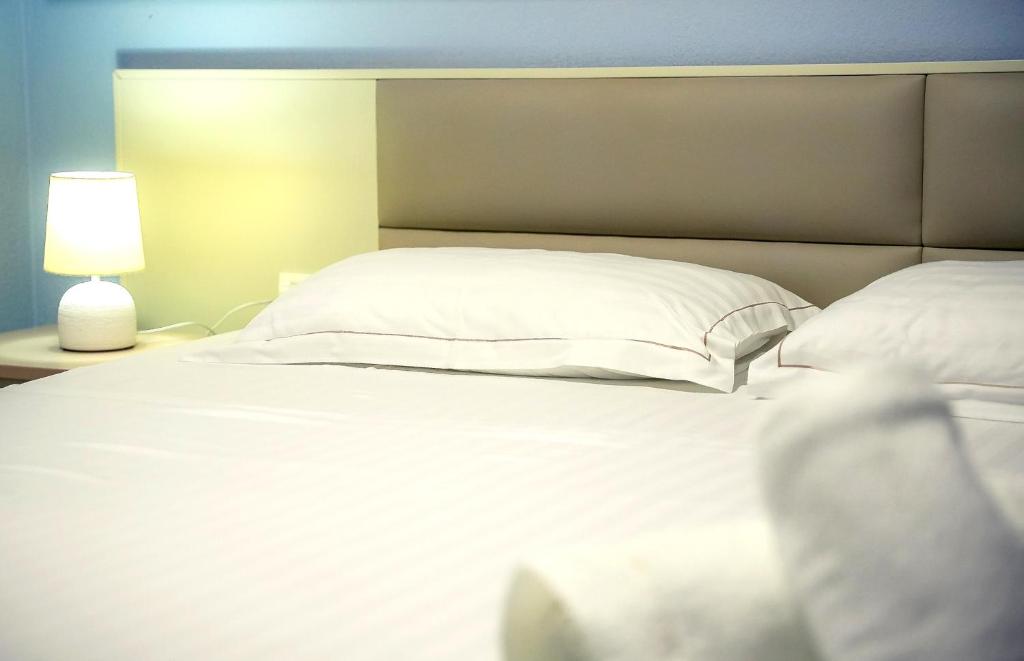Postel nebo postele na pokoji v ubytování Hotel Andi