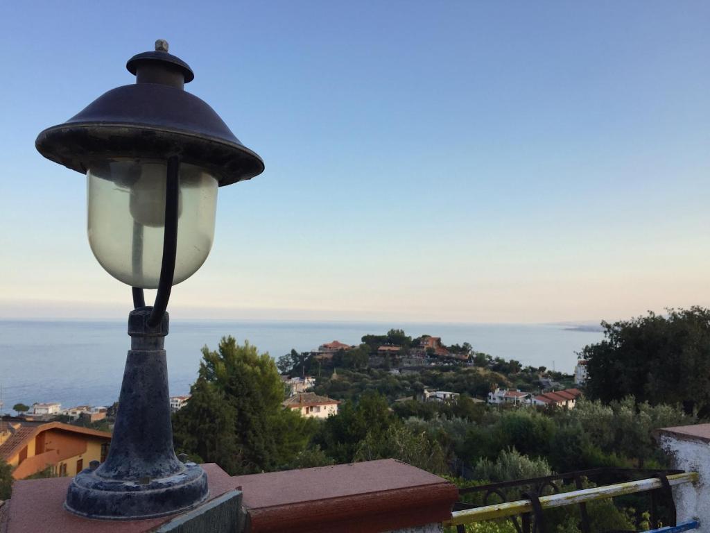 a street light on top of a building with a view at Appartamento Caminia in Stalettì
