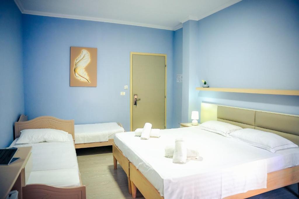Postel nebo postele na pokoji v ubytování Hotel Andi