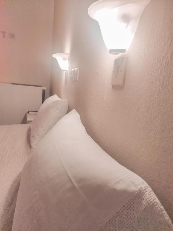 Postel nebo postele na pokoji v ubytování Hotel Maria