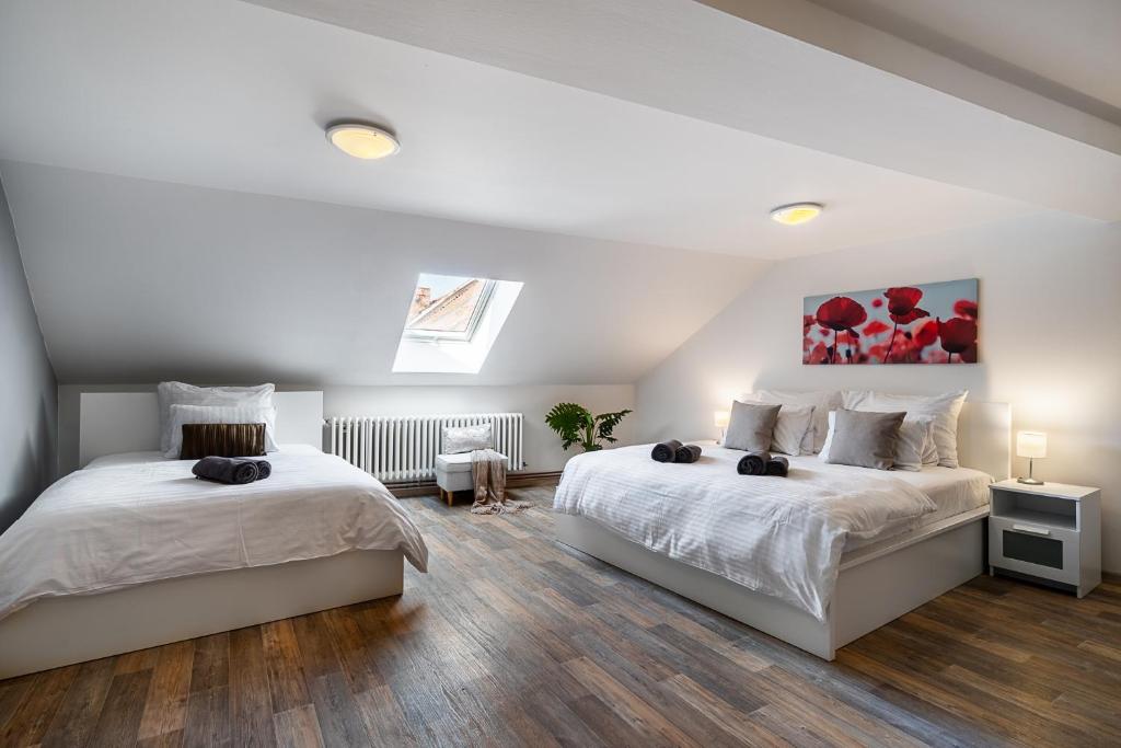Postel nebo postele na pokoji v ubytování Apartmány u Vlašského dvora