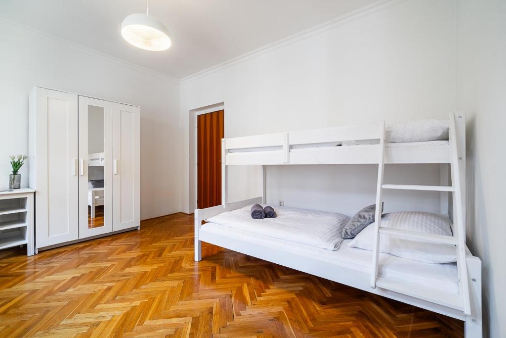 Postel nebo postele na pokoji v ubytování Apartmány u Vlašského dvora