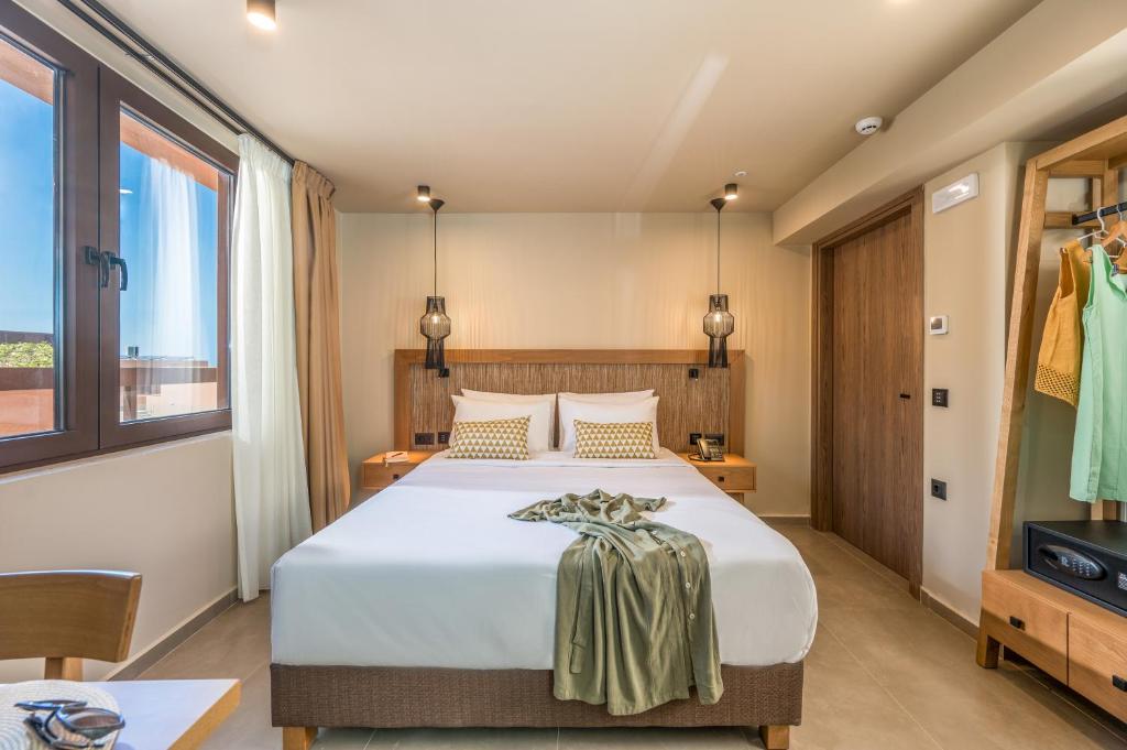 Postel nebo postele na pokoji v ubytování Hotel Pyriá