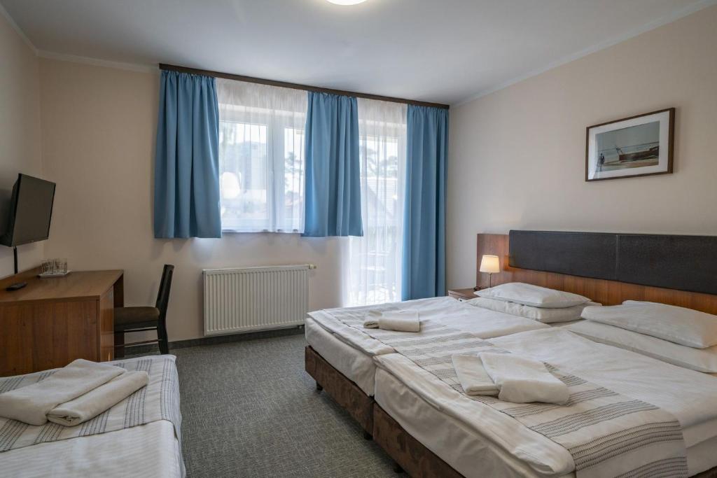Postel nebo postele na pokoji v ubytování Maximus Spa