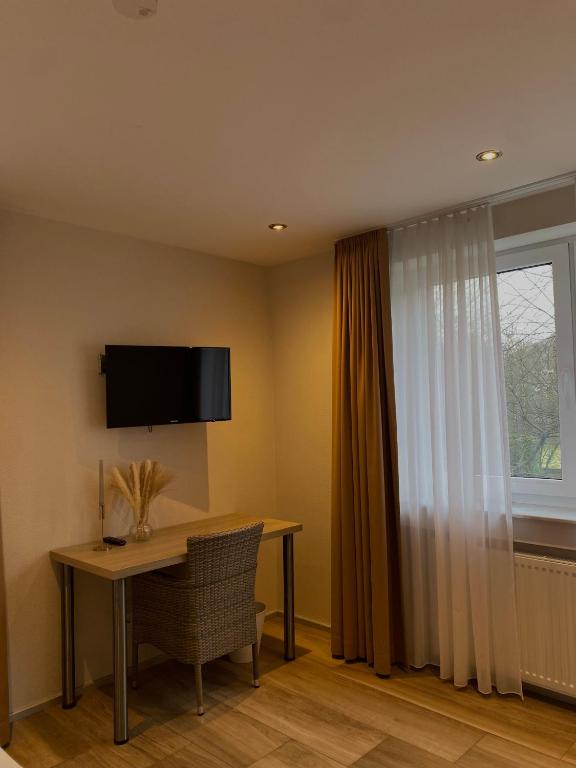 TV a/nebo společenská místnost v ubytování Hotel Scheid