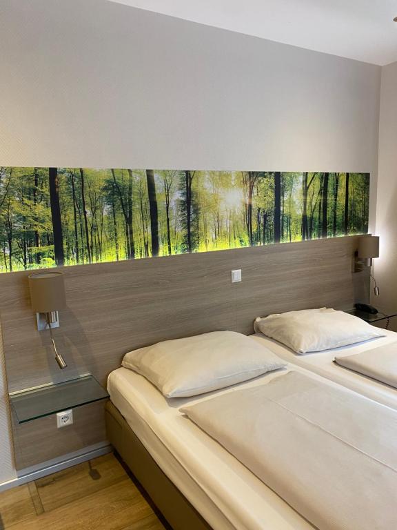 Postel nebo postele na pokoji v ubytování Hotel Scheid