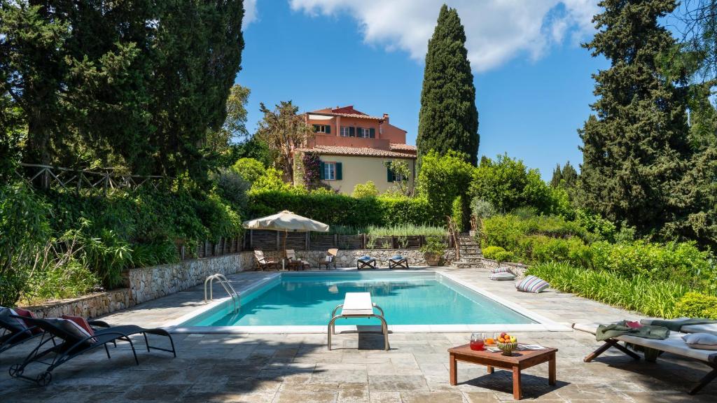 a pool in the backyard of a house at CASA DEL DUCA 10, Emma Villas in Portoferraio