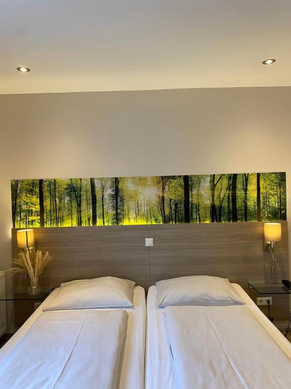Postel nebo postele na pokoji v ubytování Hotel Scheid