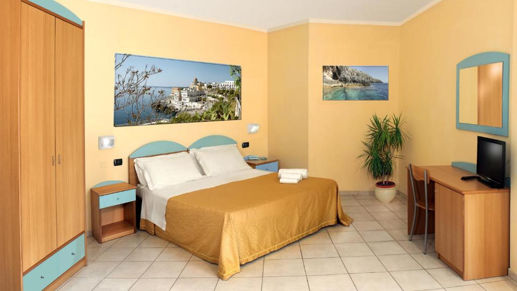 Postel nebo postele na pokoji v ubytování Hotel Alizé