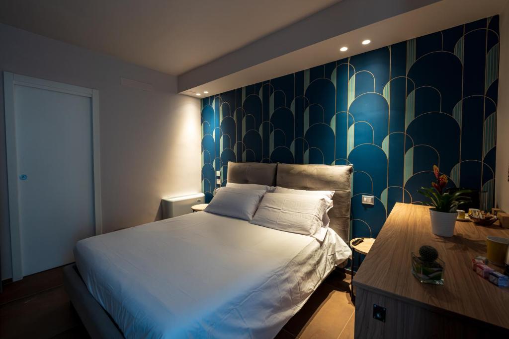 Postel nebo postele na pokoji v ubytování ArcoLoBello B&B ApartHotel