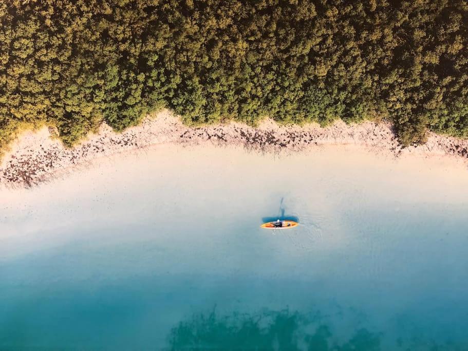 an aerial view of a boat in a body of water at Fabulous Residential Private Apartment Upgraded Full Sea & Mangrove Views Abu Dhabi - Not Hotel - 1106 in Abu Dhabi