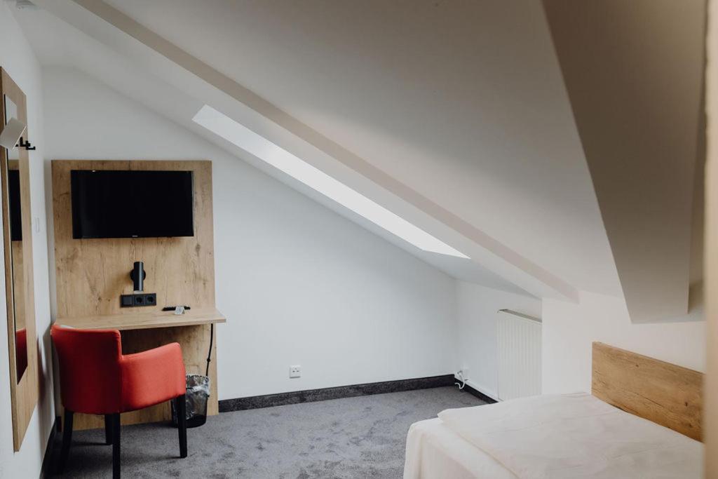 Postel nebo postele na pokoji v ubytování Hotel Dreieich