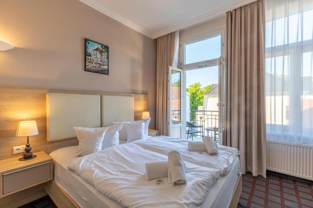 Postel nebo postele na pokoji v ubytování Hotel Polar-Stern