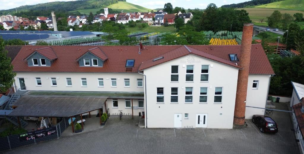a large white building with a red roof at Boardinghouse - Alte Mühle in Großbottwar