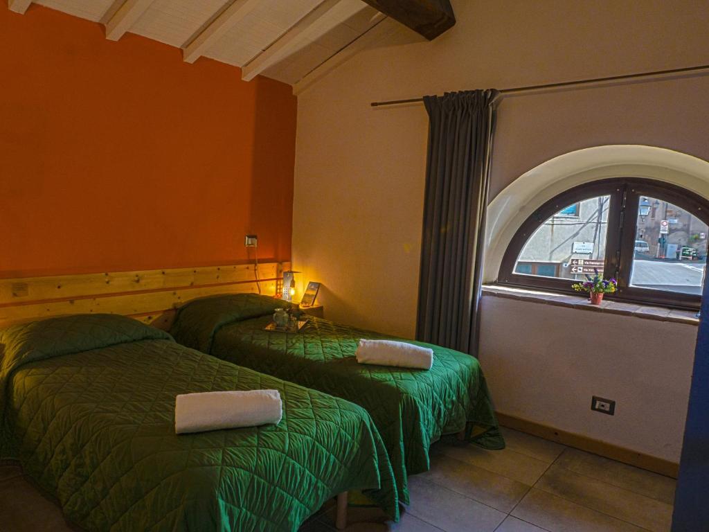 Postel nebo postele na pokoji v ubytování S'Osteria 38