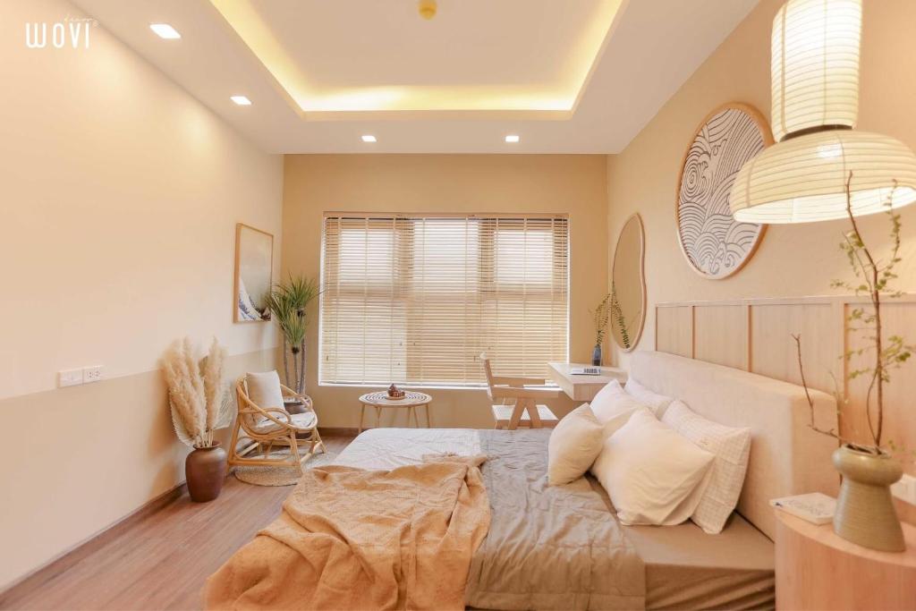 Postel nebo postele na pokoji v ubytování Tony Apartment -FLC Sea Tower Quy Nhon
