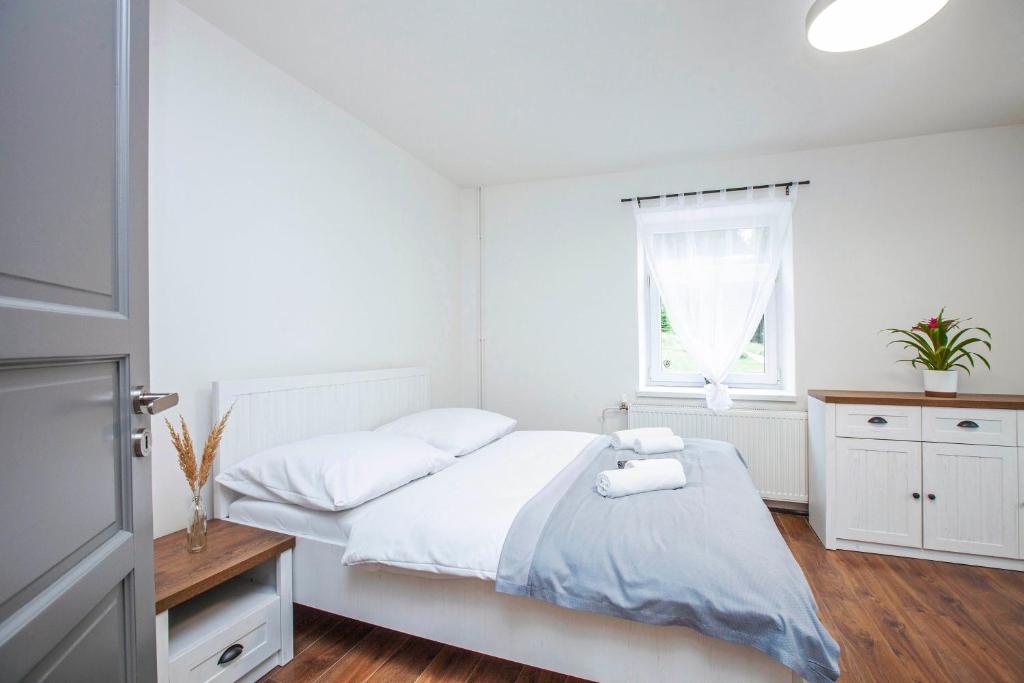Postel nebo postele na pokoji v ubytování Apartmány Vilka Orlík