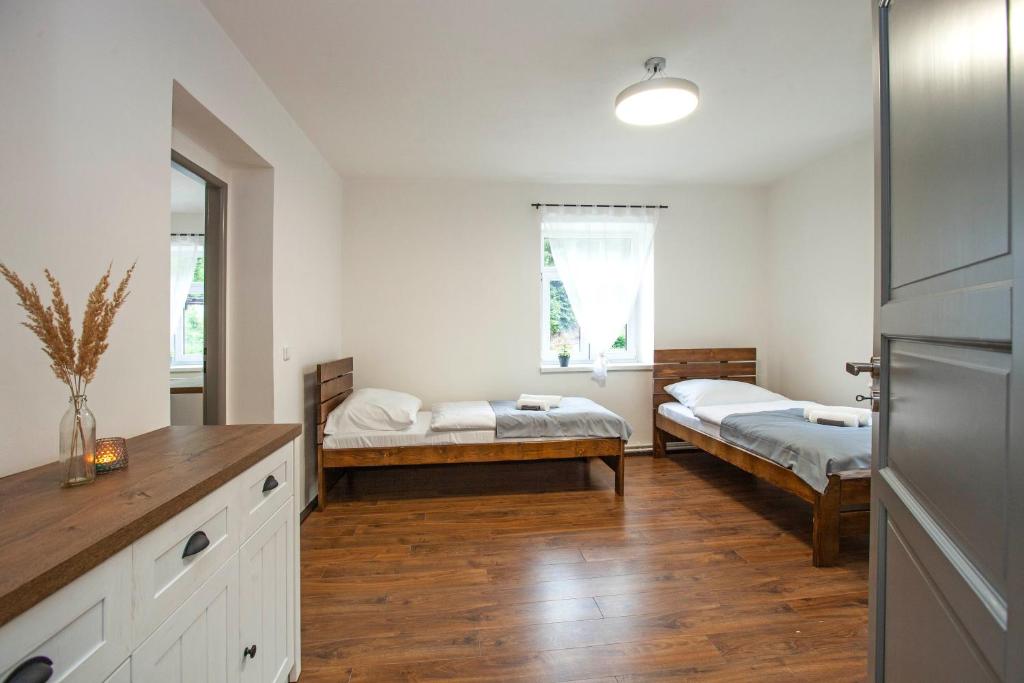 Postel nebo postele na pokoji v ubytování Apartmány Vilka Orlík