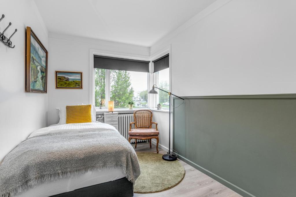 Postel nebo postele na pokoji v ubytování Flóki by Guesthouse Reykjavík