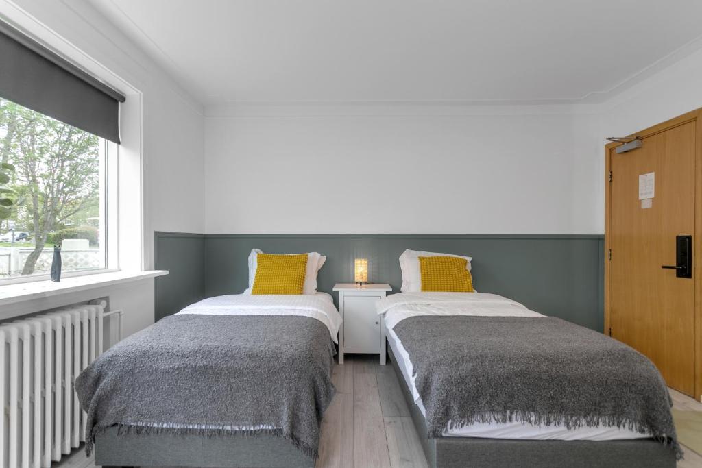Postel nebo postele na pokoji v ubytování Flóki by Guesthouse Reykjavík