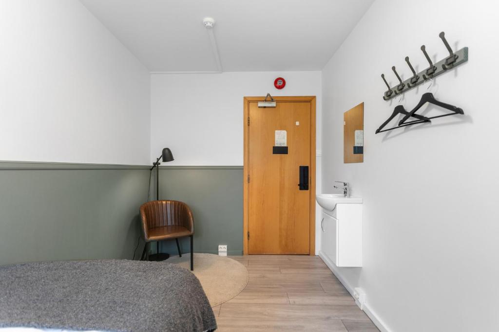 Postel nebo postele na pokoji v ubytování Flóki by Guesthouse Reykjavík