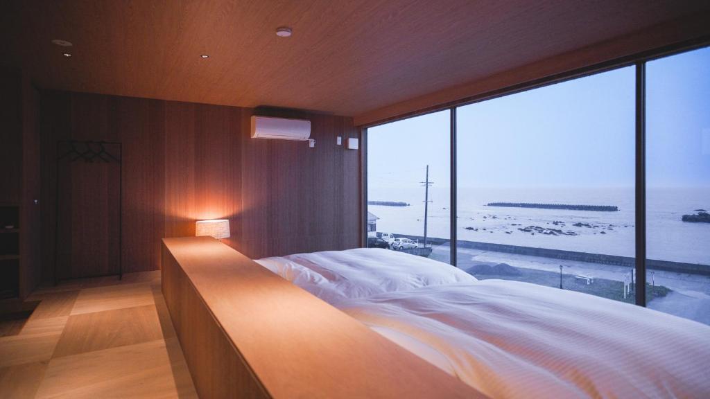 Postel nebo postele na pokoji v ubytování cometa伊勢志摩の一番星Venusウィーナス