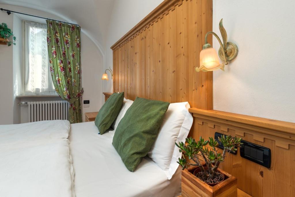 Posteľ alebo postele v izbe v ubytovaní Albergo Alla Costa