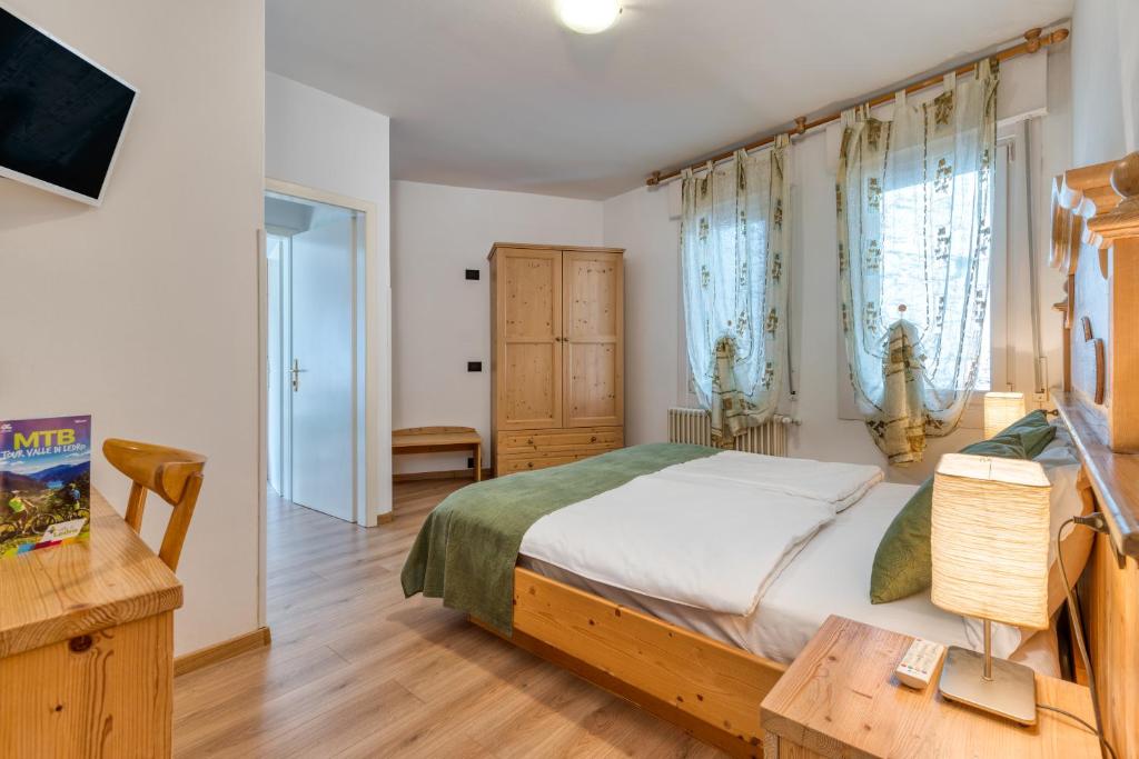 Posteľ alebo postele v izbe v ubytovaní Albergo Alla Costa