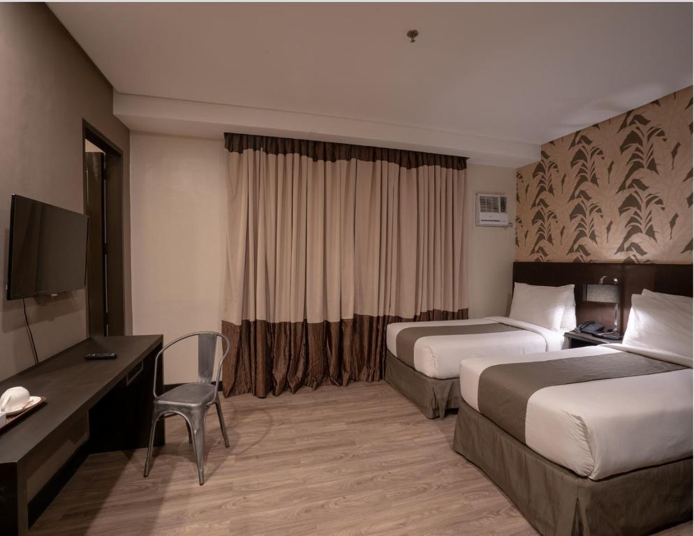 Postel nebo postele na pokoji v ubytování GT Hotel Jaro